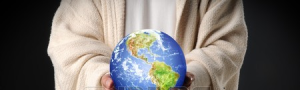 123RF-hands-of-jesus-holding-world-in-hands-over-dark-background